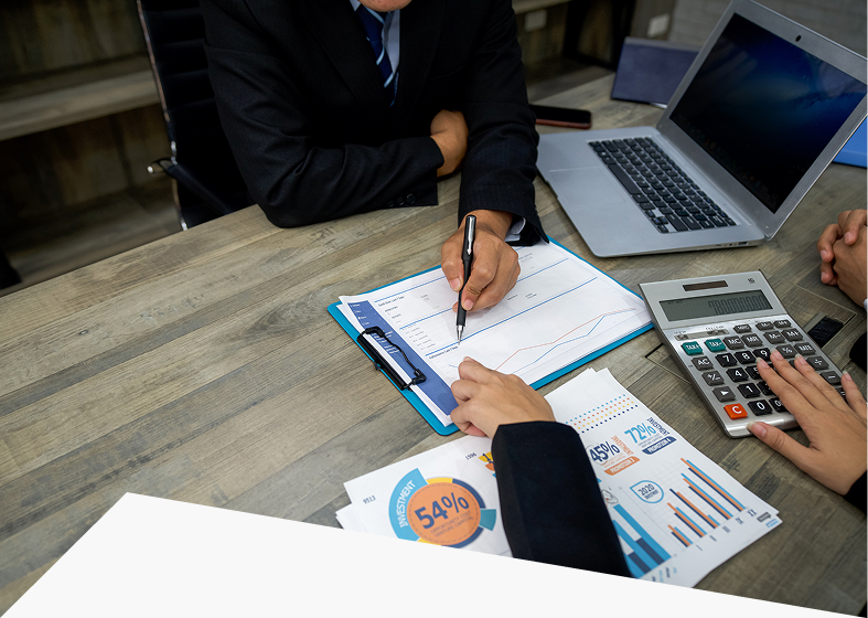 Business meeting with documents and calculator.