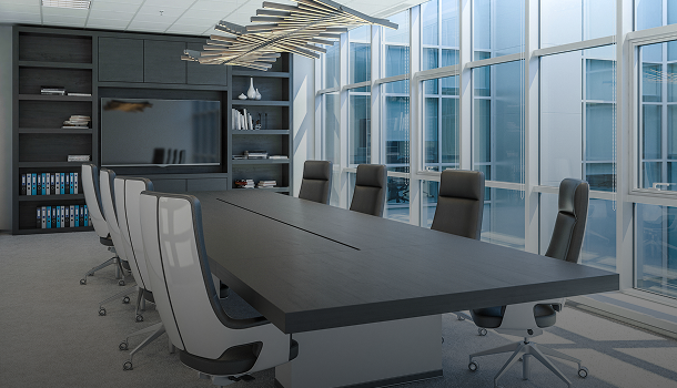 Modern conference room with large table and chairs.